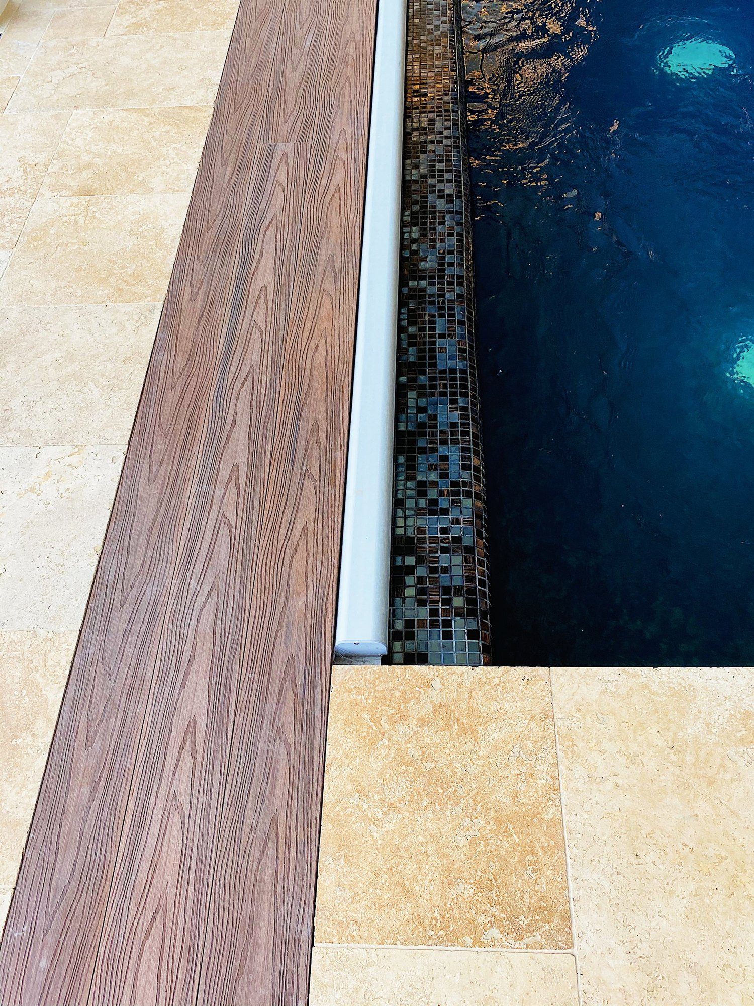 Timber-effect decking and mosaic tile